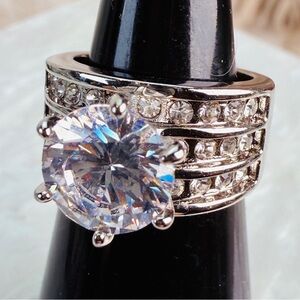 Elegant Silvertone sz 4 3/4 Ultra Bling wedding band ring